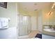 Bathroom with double sinks, a large shower, and neutral tile flooring at 648 Copeland Dr, Haines City, FL 33844