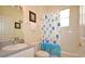 Bathroom with tub shower, toilet, and single vanity at 648 Copeland Dr, Haines City, FL 33844