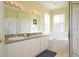Bathroom features double sinks, a soaking tub, and a shower at 648 Copeland Dr, Haines City, FL 33844