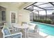 Enjoy dining al fresco by the screened pool at 648 Copeland Dr, Haines City, FL 33844