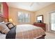 Spacious main bedroom with a king-size bed and access to a patio at 648 Copeland Dr, Haines City, FL 33844