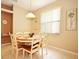 Dining area with oval table and six chairs, offering casual dining space at 648 Copeland Dr, Haines City, FL 33844