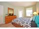 Bedroom with a queen-size bed, dresser, and patio access at 648 Copeland Dr, Haines City, FL 33844