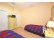 Bedroom with two twin beds featuring colorful bedding at 648 Copeland Dr, Haines City, FL 33844