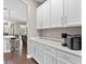 Kitchen with white cabinets and quartz countertops at 5222 Waterside Vista Ln, St Cloud, FL 34771