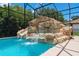 Pool with custom rock waterfall and slide at 5222 Waterside Vista Ln, St Cloud, FL 34771