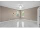 Bright bedroom with ceiling fan and marble-look flooring at 5222 Waterside Vista Ln, St Cloud, FL 34771