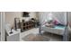 Bedroom with canopy bed and an area rug at 5222 Waterside Vista Ln, St Cloud, FL 34771
