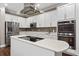 Modern kitchen with stainless steel appliances and white cabinetry at 5222 Waterside Vista Ln, St Cloud, FL 34771