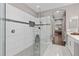 Large walk-in shower with pebble flooring and glass enclosure at 5222 Waterside Vista Ln, St Cloud, FL 34771