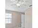 Simple bedroom with hardwood floors and ceiling fan at 5222 Waterside Vista Ln, St Cloud, FL 34771