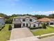 Two-story luxury home with attractive landscaping and a large driveway at 5222 Waterside Vista Ln, St Cloud, FL 34771