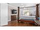Spacious main bedroom with a large four poster bed and private access to the backyard at 5222 Waterside Vista Ln, St Cloud, FL 34771