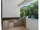 Modern outdoor kitchen with granite countertop at 5222 Waterside Vista Ln, St Cloud, FL 34771