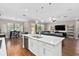 Modern kitchen with large island and breakfast bar at 5222 Waterside Vista Ln, St Cloud, FL 34771