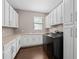 Laundry room with white cabinets, countertop, and washer/dryer at 5222 Waterside Vista Ln, St Cloud, FL 34771