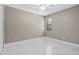 Bright bedroom with neutral walls and tile flooring at 5222 Waterside Vista Ln, St Cloud, FL 34771