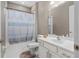 Clean bathroom with white vanity and shower/tub combo at 5222 Waterside Vista Ln, St Cloud, FL 34771