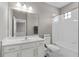 Clean bathroom with white vanity, toilet and bathtub at 5222 Waterside Vista Ln, St Cloud, FL 34771