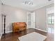 Room with hardwood floors, a piano, and access to a bathroom at 5222 Waterside Vista Ln, St Cloud, FL 34771
