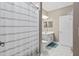Clean bathroom with striped shower curtain at 5222 Waterside Vista Ln, St Cloud, FL 34771