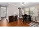 Breakfast nook with dark wood floors and modern table and chairs at 5222 Waterside Vista Ln, St Cloud, FL 34771