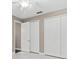 Well-lit bedroom with double door closet and tile flooring at 5222 Waterside Vista Ln, St Cloud, FL 34771