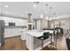 Modern kitchen featuring white cabinets, stainless steel appliances, and a large island at 5222 Waterside Vista Ln, St Cloud, FL 34771