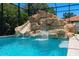 Custom rock waterfall and slide in the pool at 5222 Waterside Vista Ln, St Cloud, FL 34771