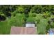 Aerial view of home showcasing large backyard and screened patio at 709 Carmel Ln, Kissimmee, FL 34759