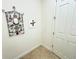 Home hallway with decorative wall art at 709 Carmel Ln, Kissimmee, FL 34759
