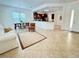 Open concept living area with kitchen, dining, and living spaces at 709 Carmel Ln, Kissimmee, FL 34759
