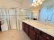 Elegant bathroom with double sinks and a large shower at 709 Carmel Ln, Kissimmee, FL 34759