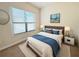 Bright bedroom with a comfortable bed and window at 709 Carmel Ln, Kissimmee, FL 34759
