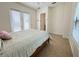 Bright bedroom with double doors leading to patio, tile floors and ceiling fan at 709 Carmel Ln, Kissimmee, FL 34759