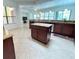 Spacious kitchen with granite countertops and dark wood cabinets at 709 Carmel Ln, Kissimmee, FL 34759