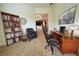 Bright home office with built-in bookcase and large desk at 709 Carmel Ln, Kissimmee, FL 34759