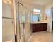 Bathroom features a large walk-in shower and double vanity at 709 Carmel Ln, Kissimmee, FL 34759