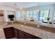 Open kitchen with breakfast bar and granite countertops at 709 Carmel Ln, Kissimmee, FL 34759