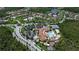 Aerial view of community with pool, tennis courts, and clubhouse at 709 Carmel Ln, Kissimmee, FL 34759