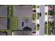 Aerial view of a house with solar panels and a backyard at 2414 Fenetre Ln, Kissimmee, FL 34741