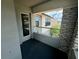 Private balcony with glass railing and view of houses at 2414 Fenetre Ln, Kissimmee, FL 34741
