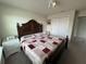 Spacious bedroom with a king-size bed and a dresser at 2414 Fenetre Ln, Kissimmee, FL 34741