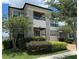 Two-story house with stone accents and a modern design at 2414 Fenetre Ln, Kissimmee, FL 34741