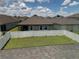 Large backyard with a white fence and grassy area at 2414 Fenetre Ln, Kissimmee, FL 34741