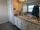 Double vanity bathroom with granite countertop at 2414 Fenetre Ln, Kissimmee, FL 34741