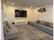 Spacious living room with sectional sofa and neutral decor at 2414 Fenetre Ln, Kissimmee, FL 34741