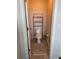 Small bathroom with toilet, shelving unit, and floor rug at 2414 Fenetre Ln, Kissimmee, FL 34741