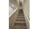 Carpeted staircase leading to the second floor at 4422 Small Creek Rd # 72, Kissimmee, FL 34744