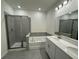Elegant bathroom with double vanity, soaking tub, and shower at 4422 Small Creek Rd # 72, Kissimmee, FL 34744